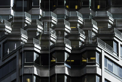 an abstract shadow play highlighting structural precision on a modern building exterior