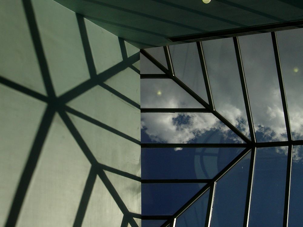 building with black framed clear roof