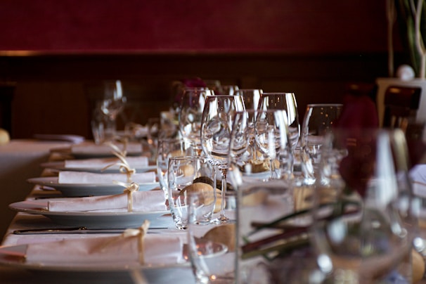 A beautifully arranged dining table with soft beige tones.