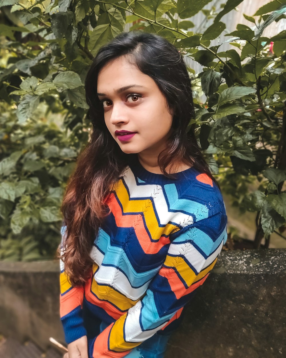 woman wears multicolored chevron long-sleeved shirt