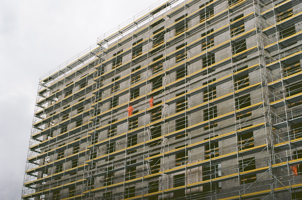 brown concrete building under cloudy sky