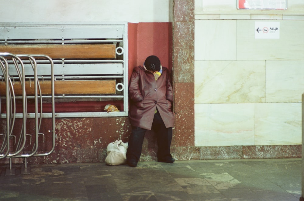 man wearing maroon leather coat