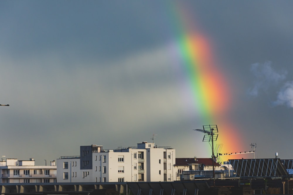 white building and rainbow