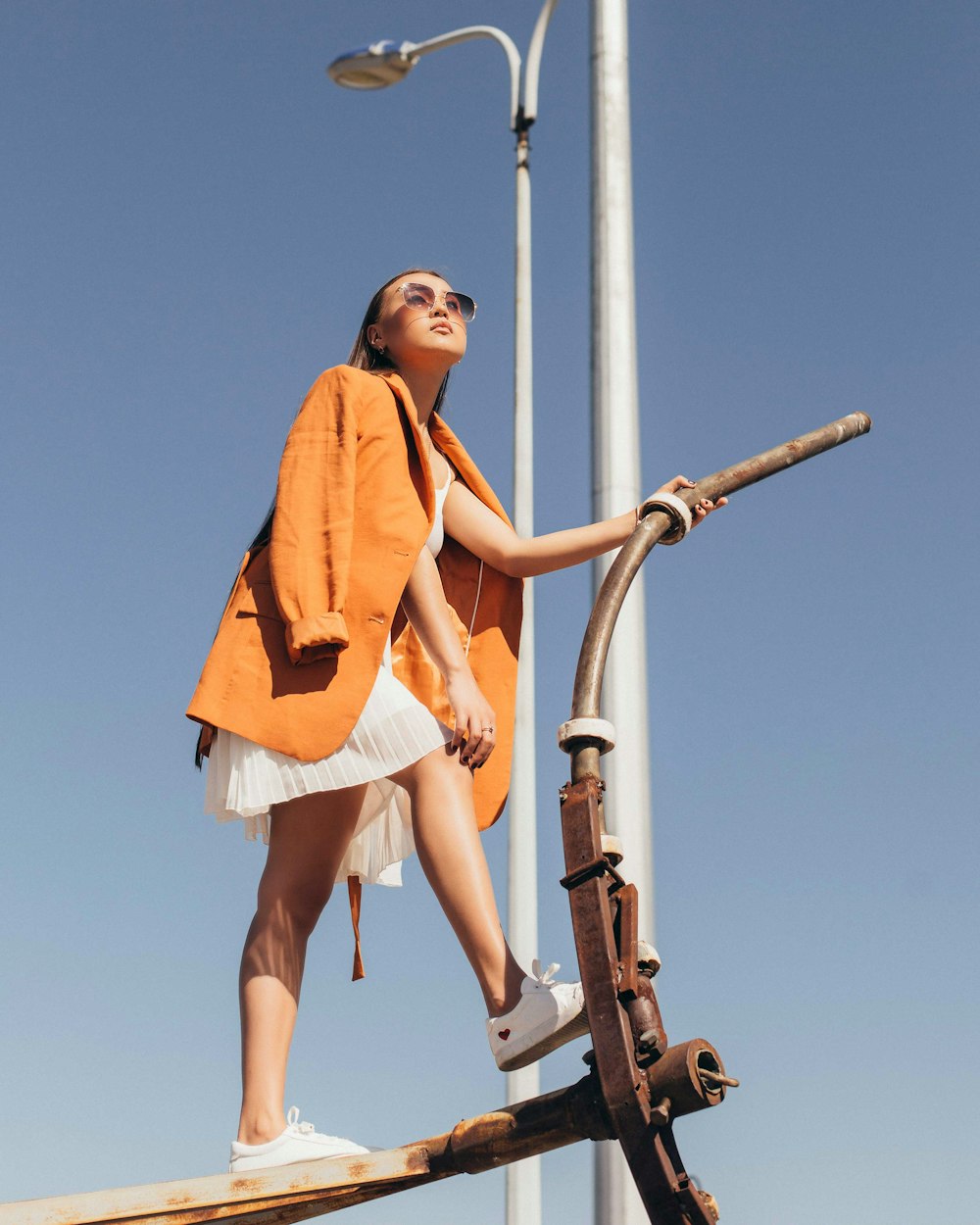 woman standing on pipe