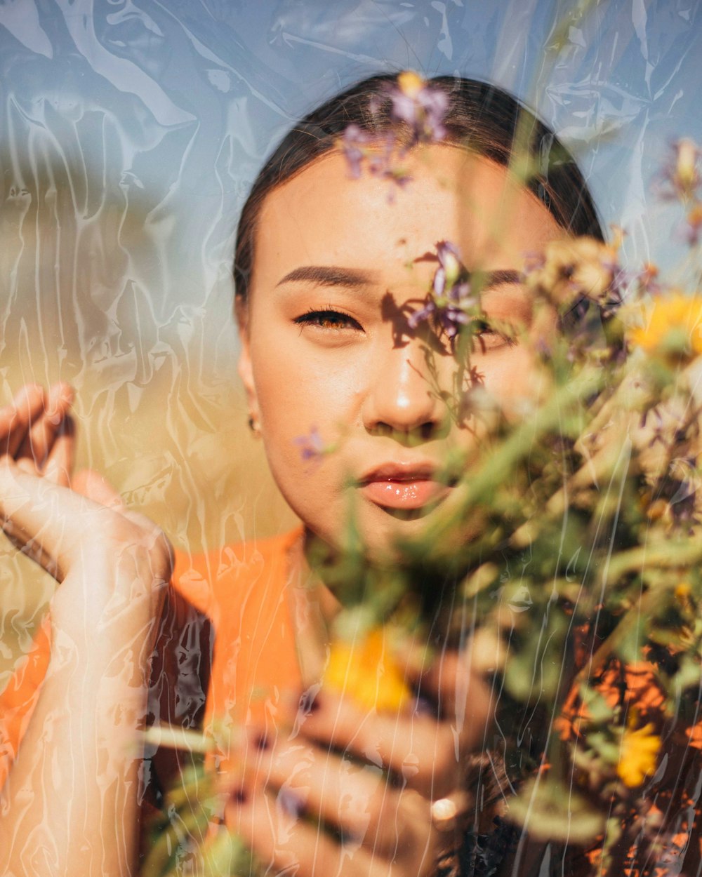 woman holding bouquet of flowers