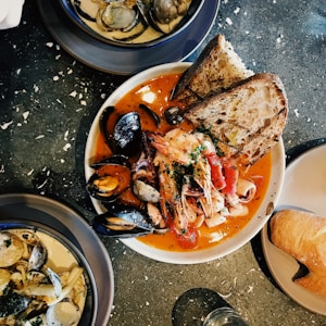 round white ceramic bowl with seafoods