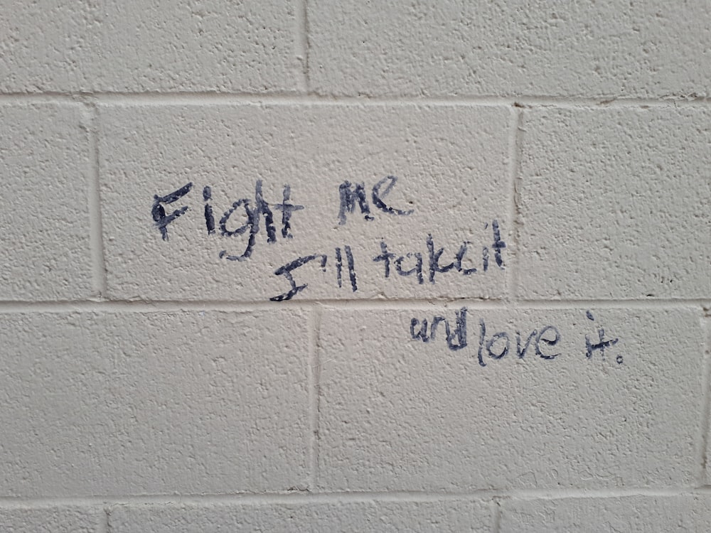 fight me I'll take it and love it sign on wall