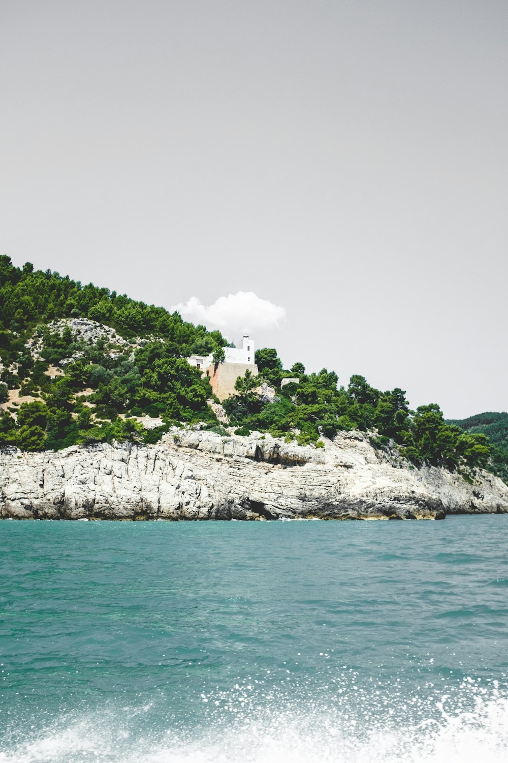 body of water under gray sky