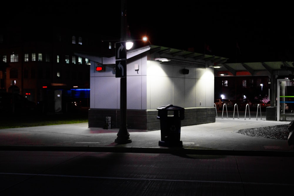 a dark street at night with a light on