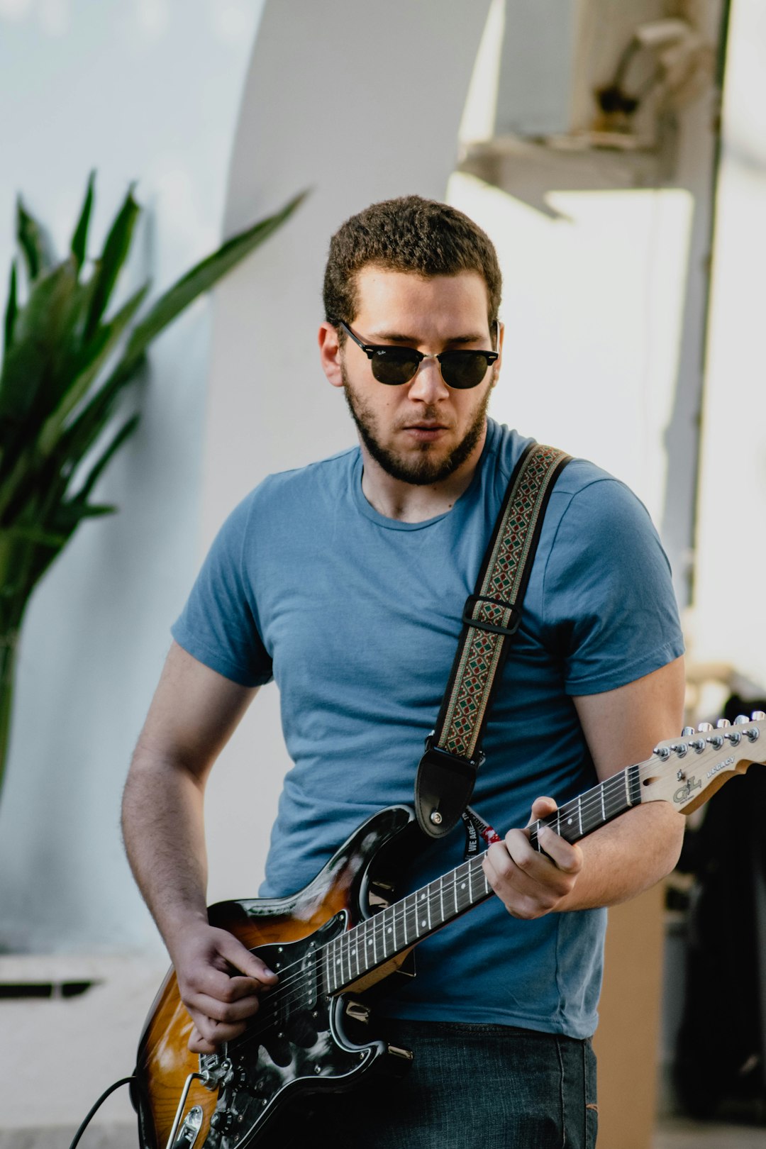 man playing electric guitar