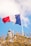 blue, white, and red flag with pole
