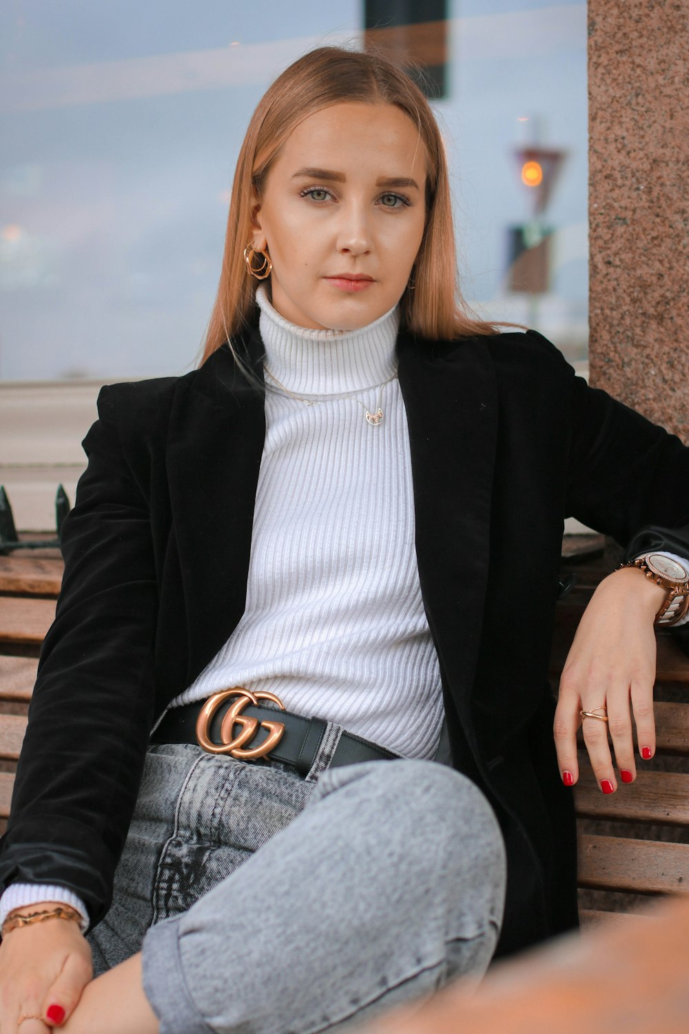 woman sits on bench