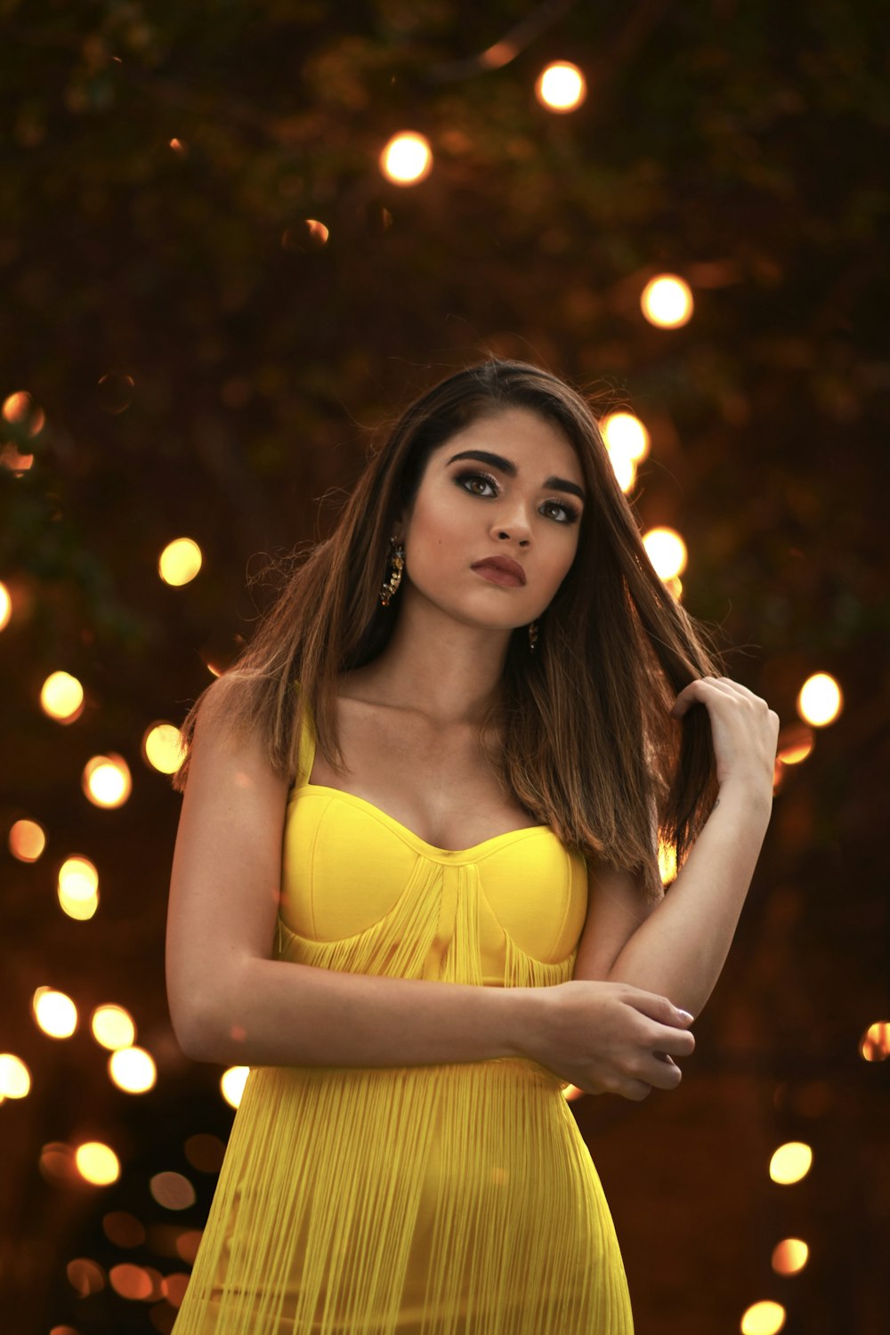 woman wearing yellow strapless dress