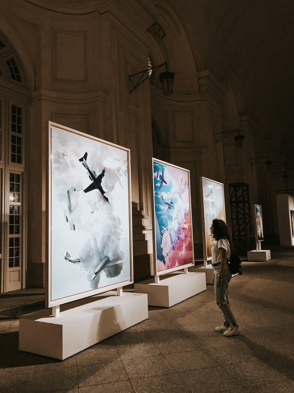 woman standing in front of painting