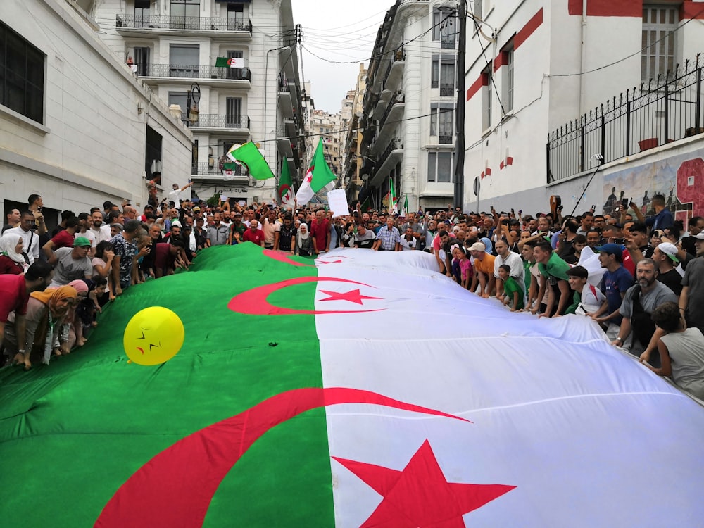 people holding huge flag