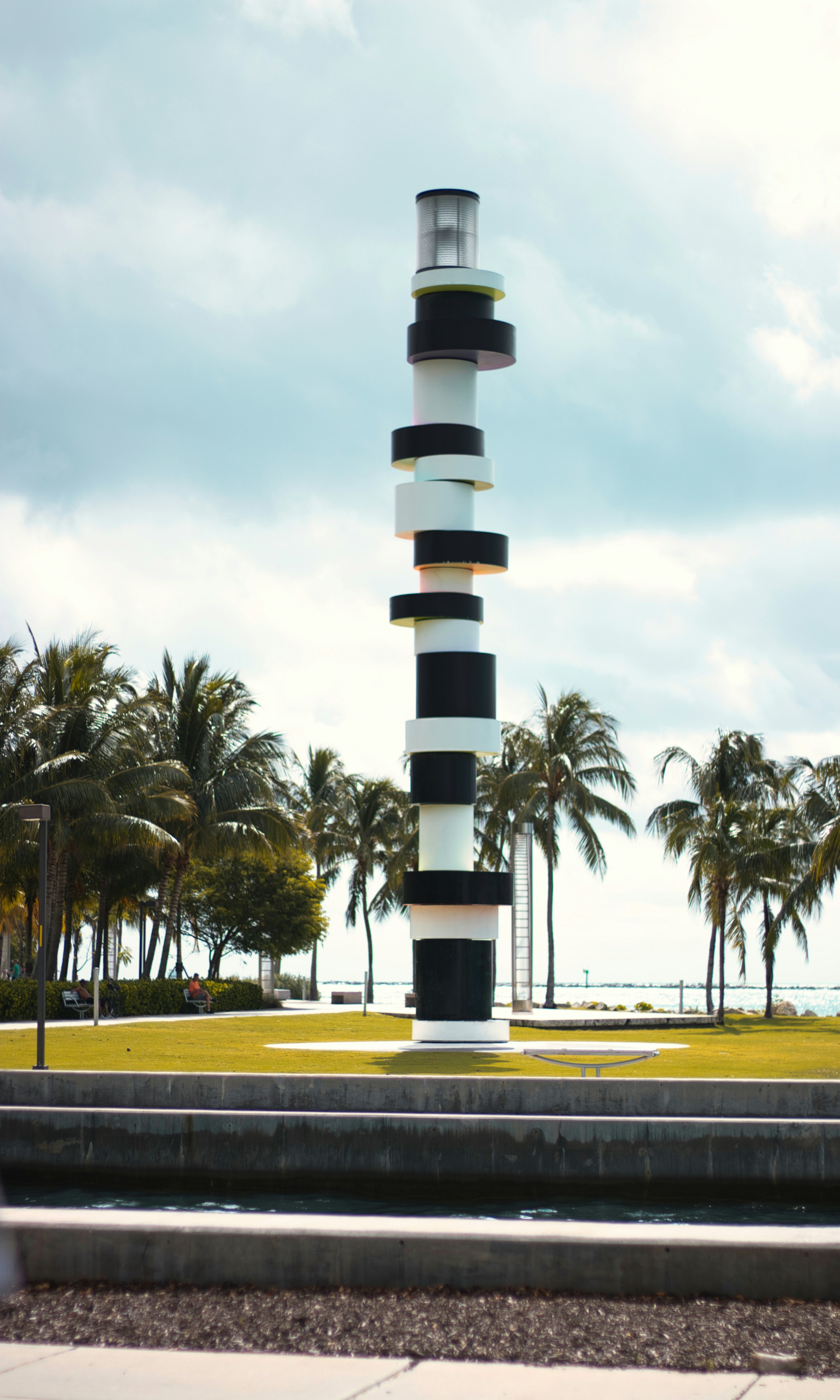 Black and white overlapping stacked tower near trees photo – Free Palm ...