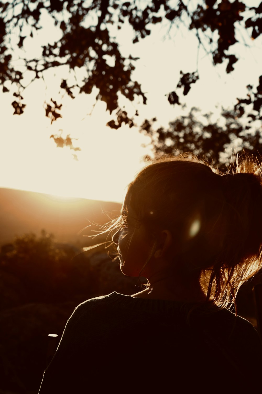 woman looking at sun