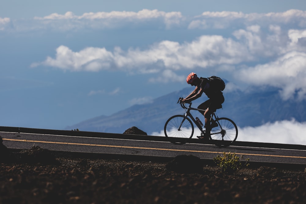 man riding on bicycle during daytime