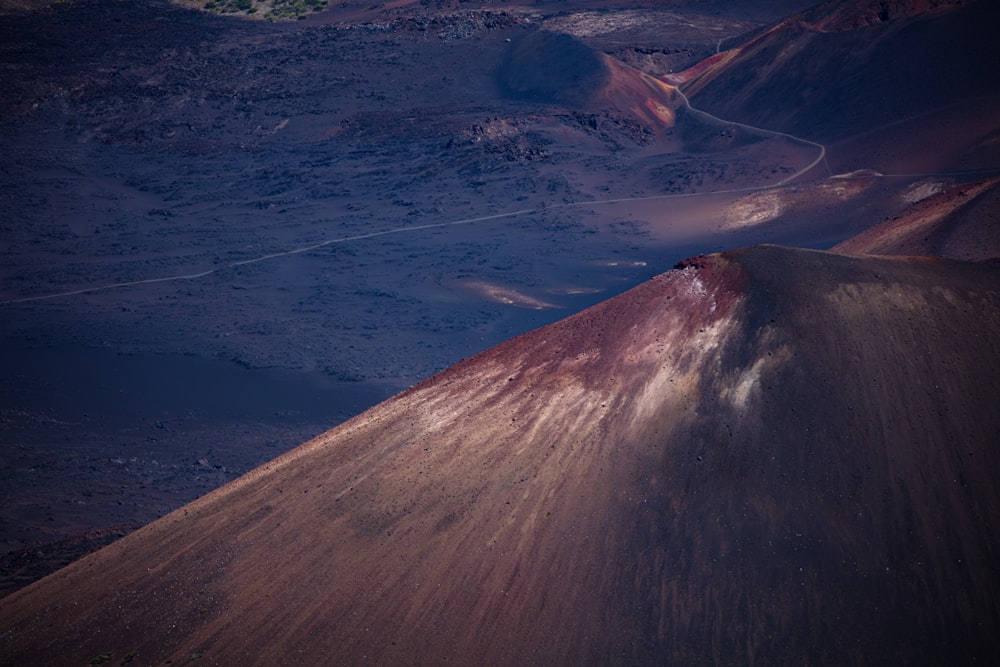 aerial photography of blue sea viewing mountain during daytime