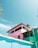 A freshly painted building with vibrant colors under a clear blue sky.