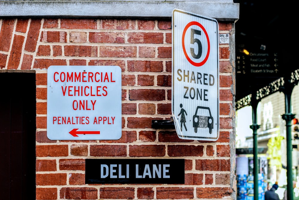 assorted white, black, and red traffic signs