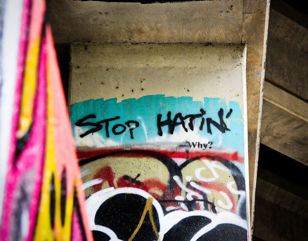 Stop Hatin' graffiti on wall
