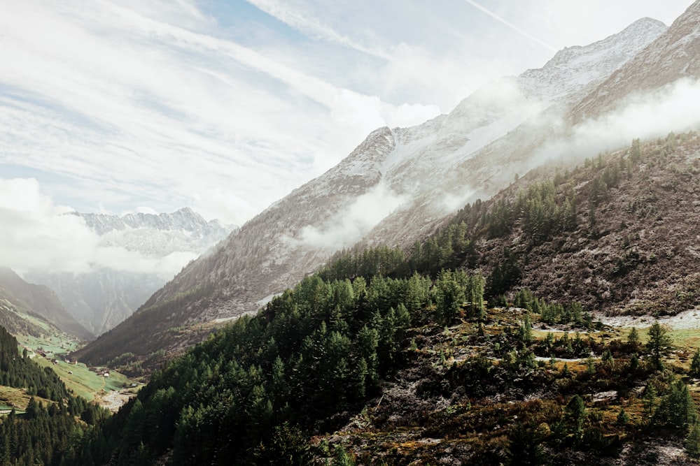 mountains covered with clouds during daytime