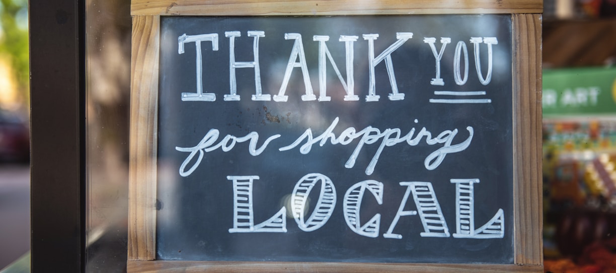 shallow focus photo of thank you for shopping signage