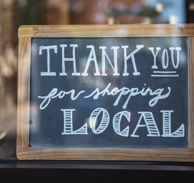 shallow focus photo of thank you for shopping signage