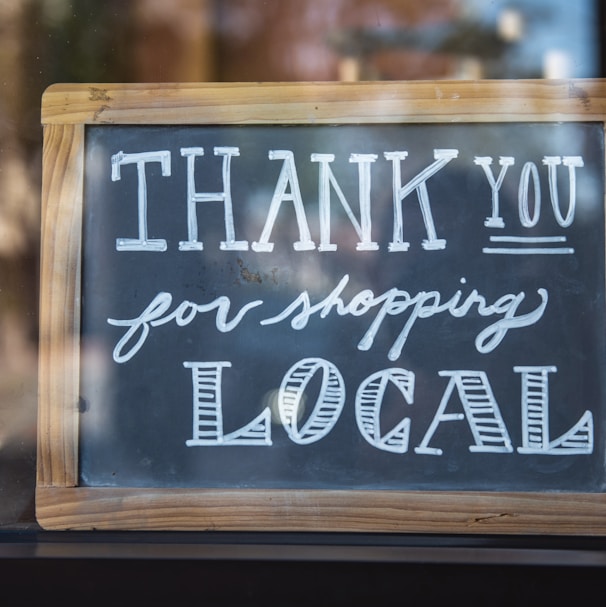 shallow focus photo of thank you for shopping signage