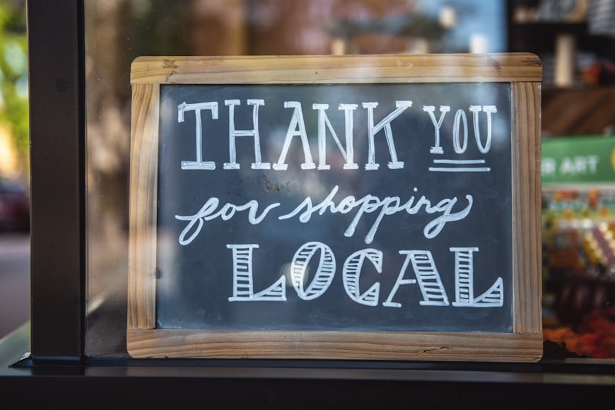 sign in window says "Thank you for shopping local"