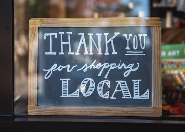 shallow focus photo of thank you for shopping signage