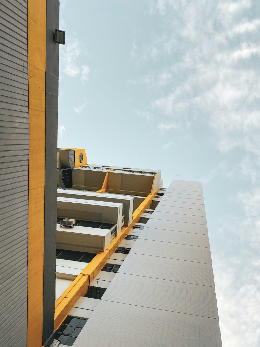 gray and yellow concrete building at daytime