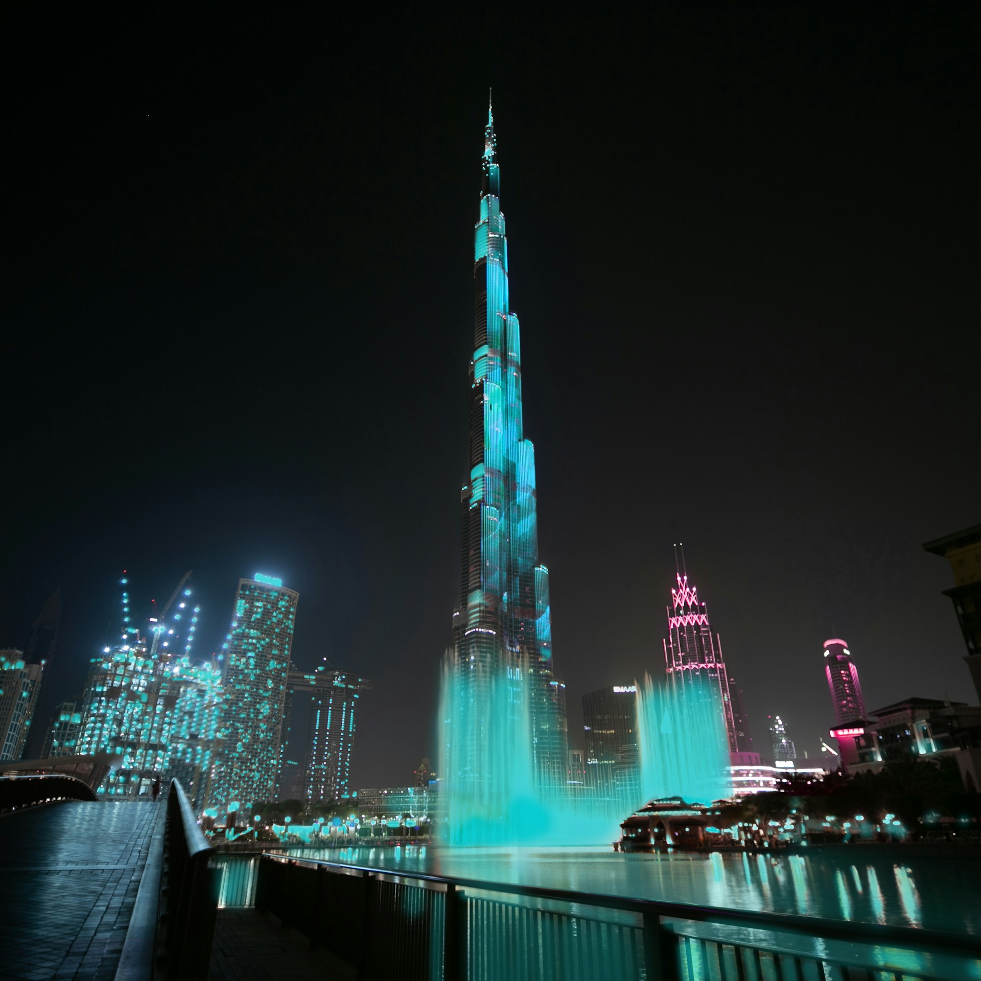 blue and pink lighted building at night time