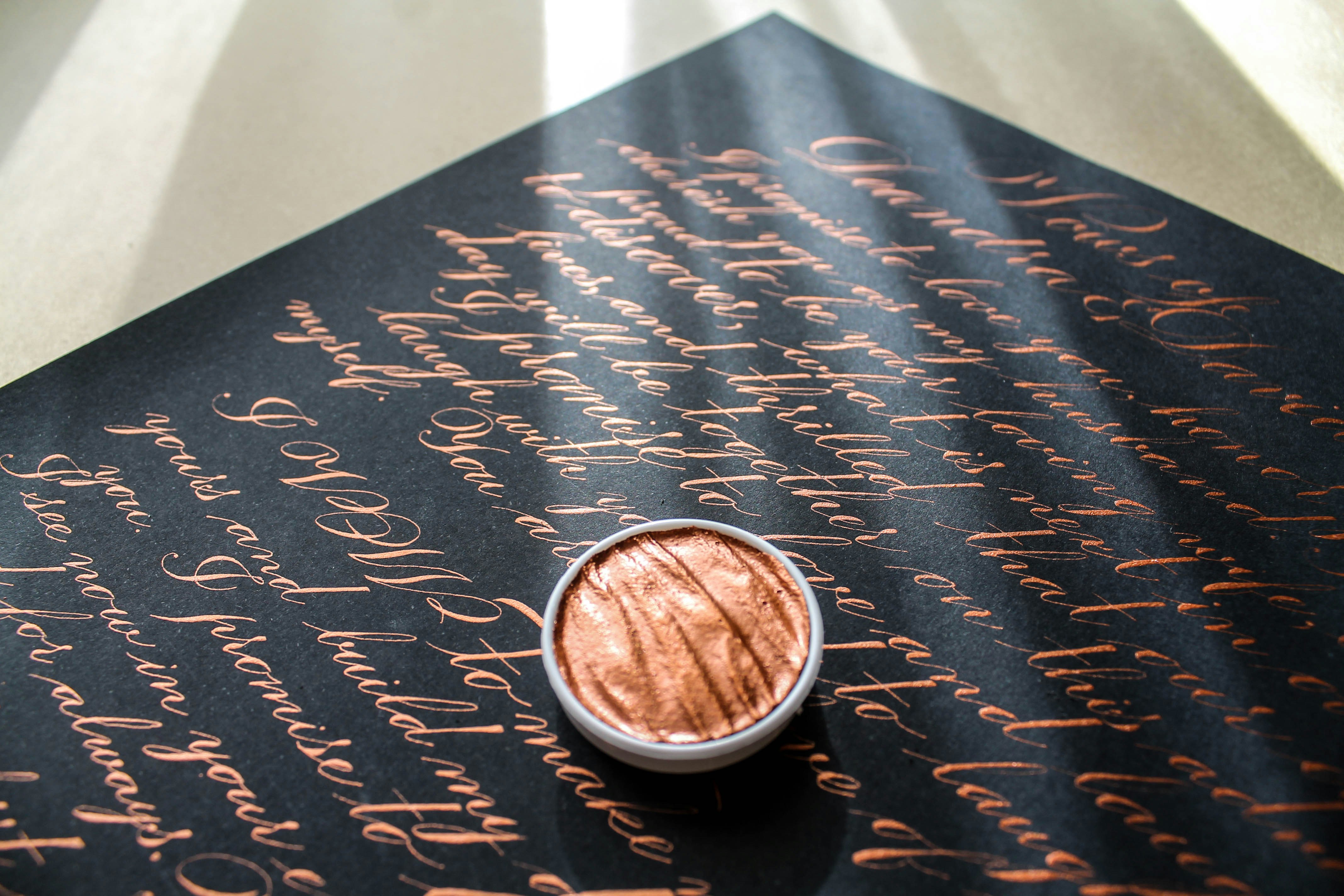 latte on black paper with text