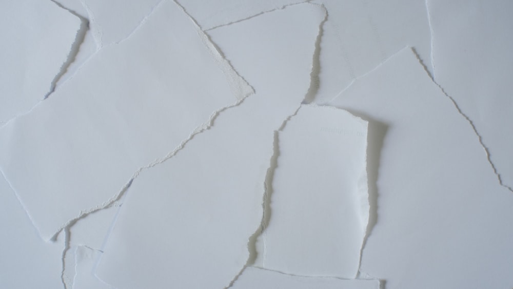 a piece of white paper that has been torn