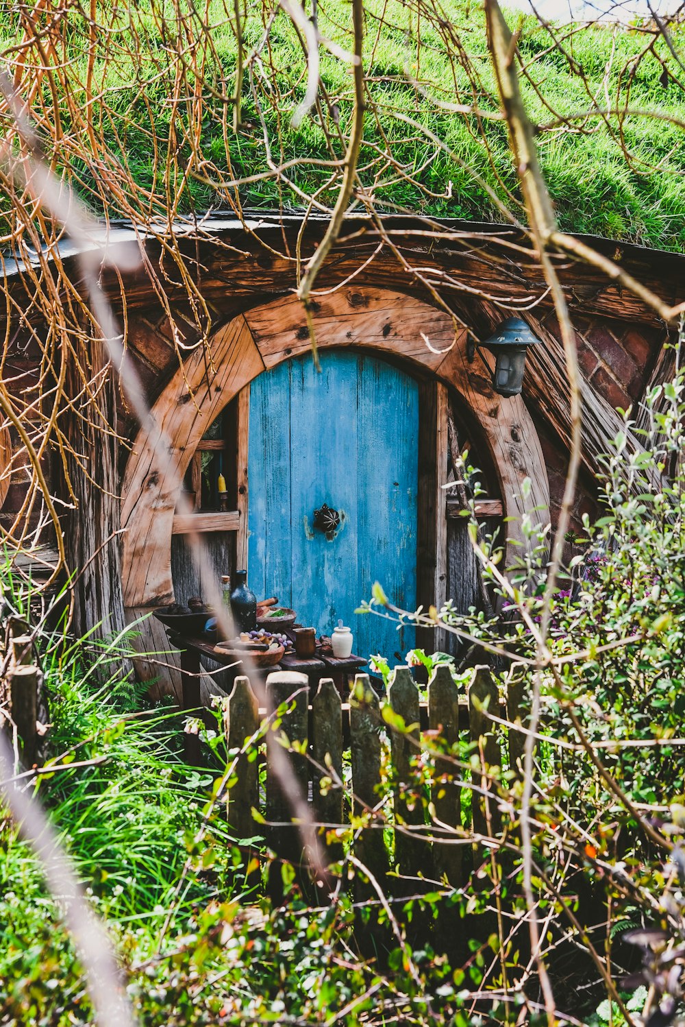 blue door on brown house