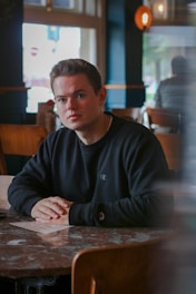 man wearing black long-sleeved shirt