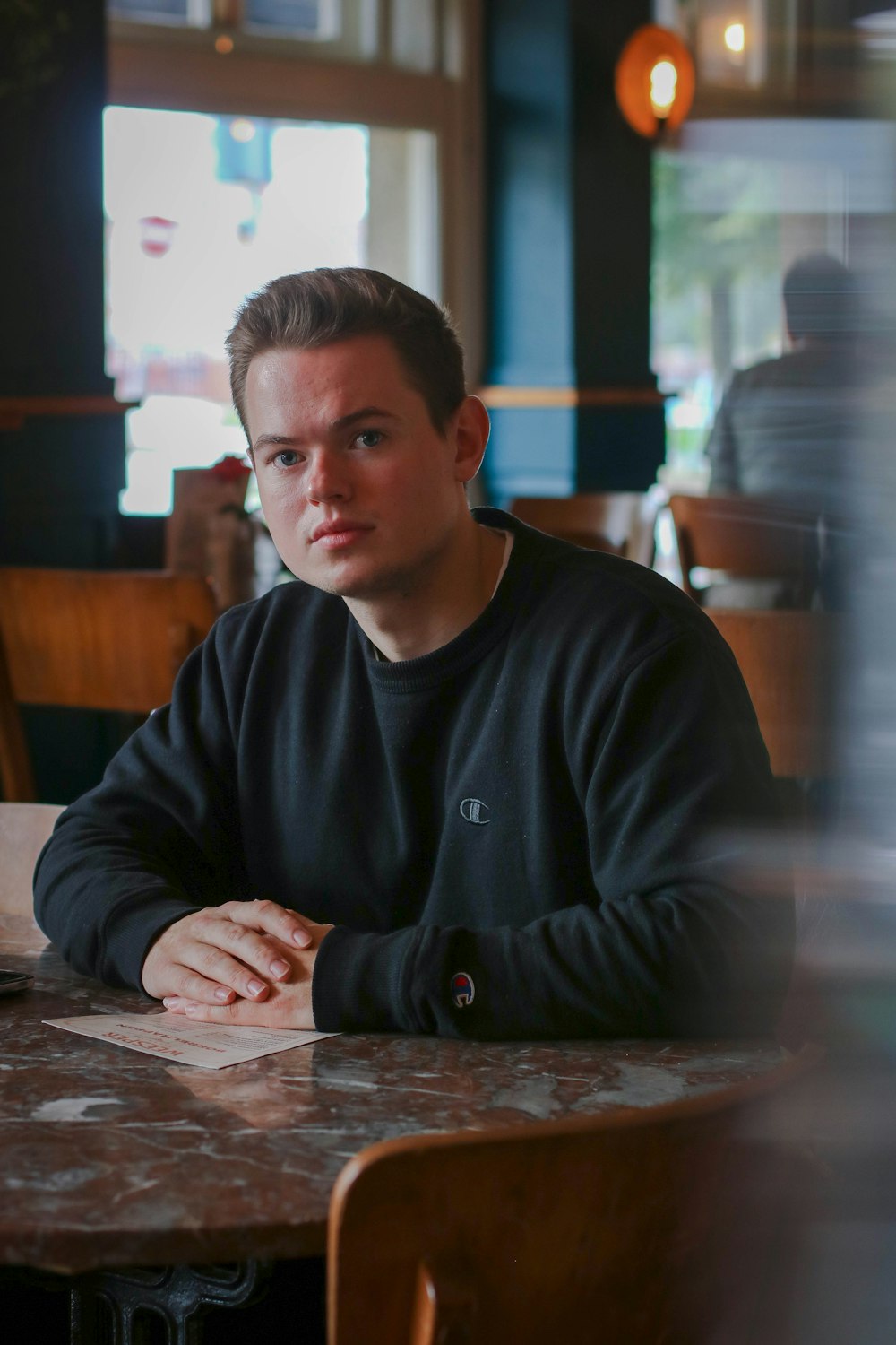 man wearing black long-sleeved shirt