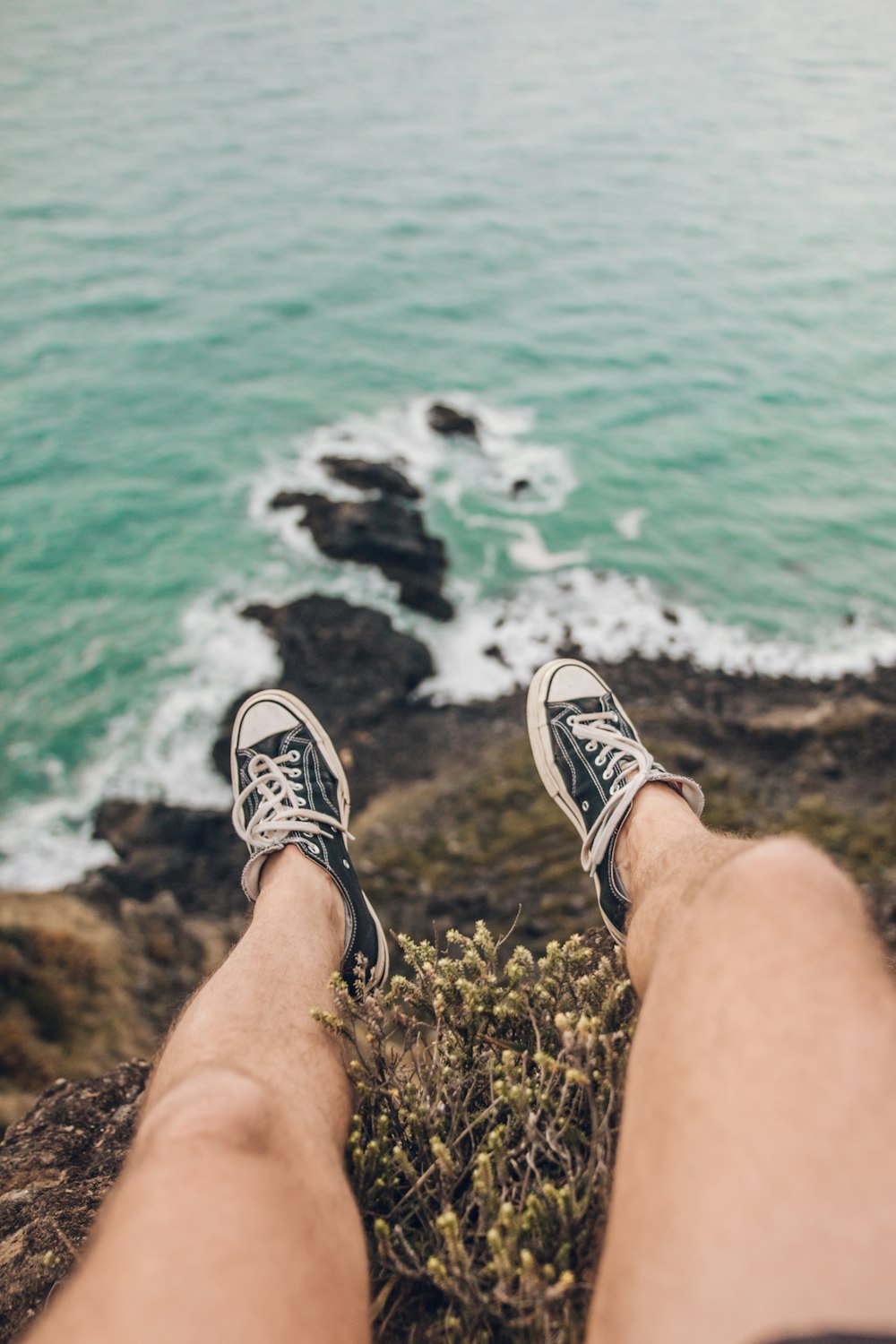 pair of blue-and-white lace-up sneakers