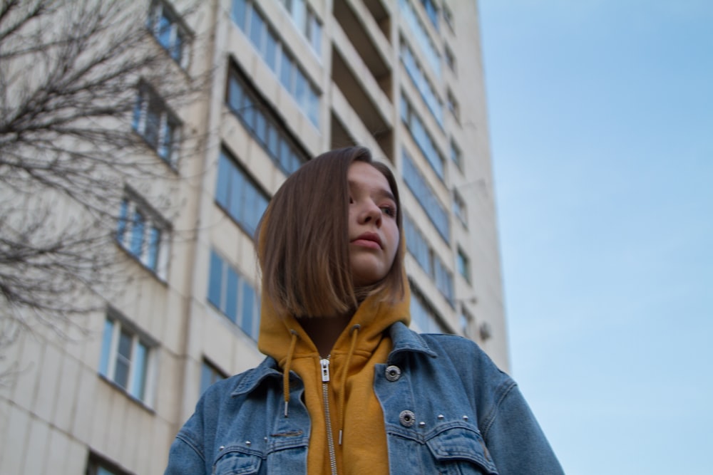 woman wearing yellow pullover hoodie and blue denim jacket photo – Free  Blue Image on Unsplash