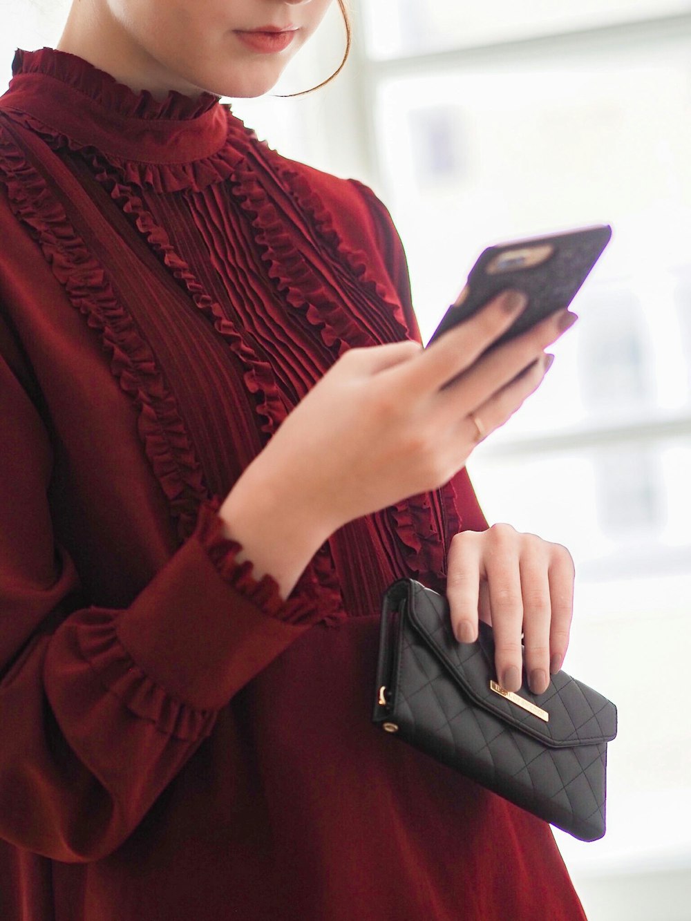 woman wearing red long-sleeved shirt