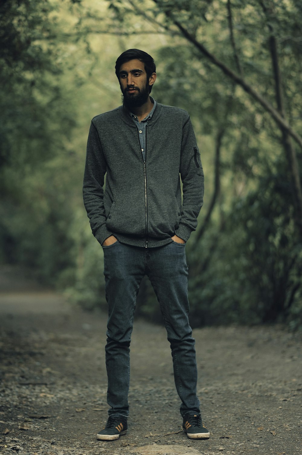 man in hoodie at forest