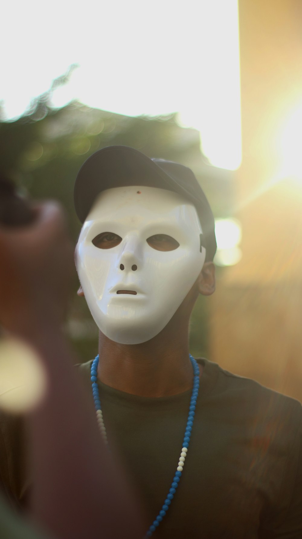 man wearing white mask