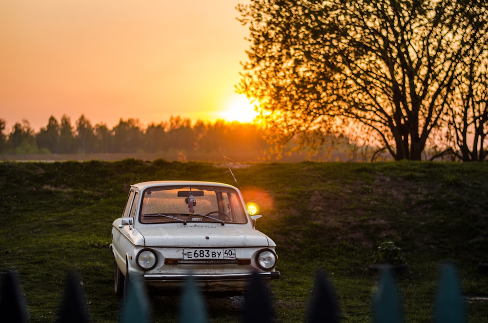 white vehicle at golden hour close-up photography