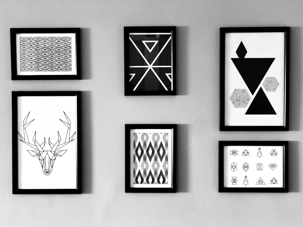 six paintings mounted on wall