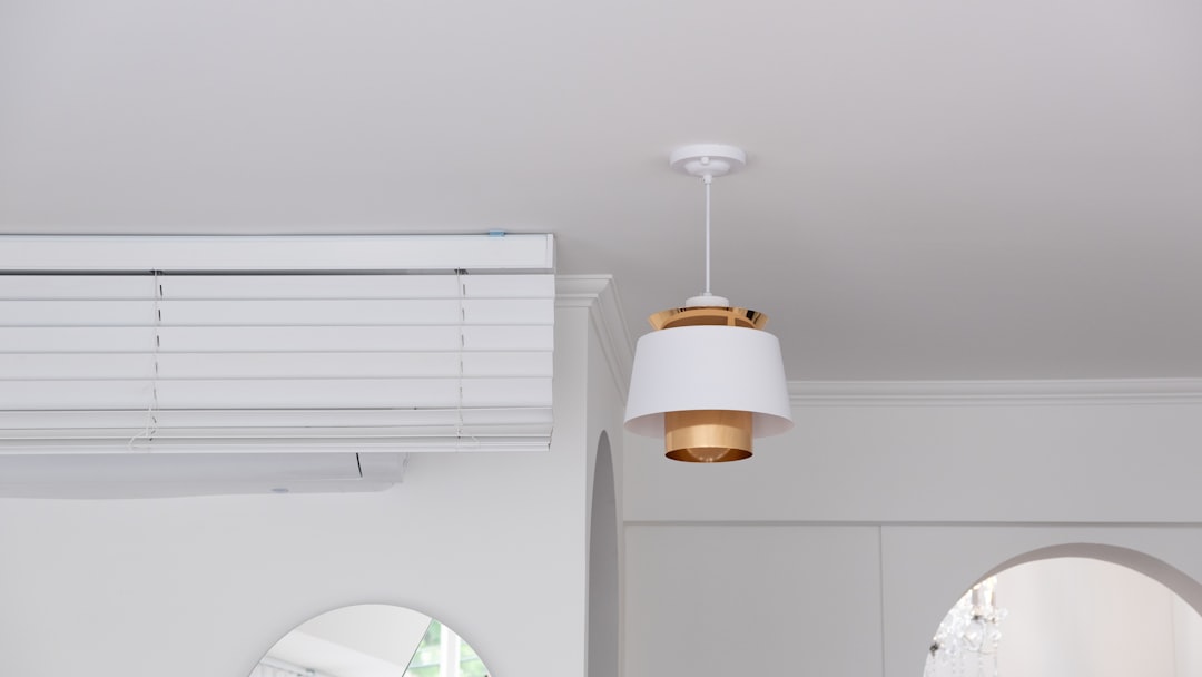 white and gold-colored pendant light