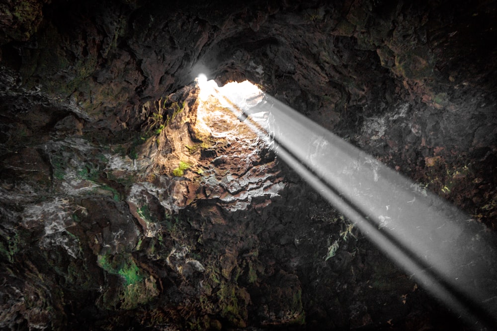 a beam of light shines into a cave