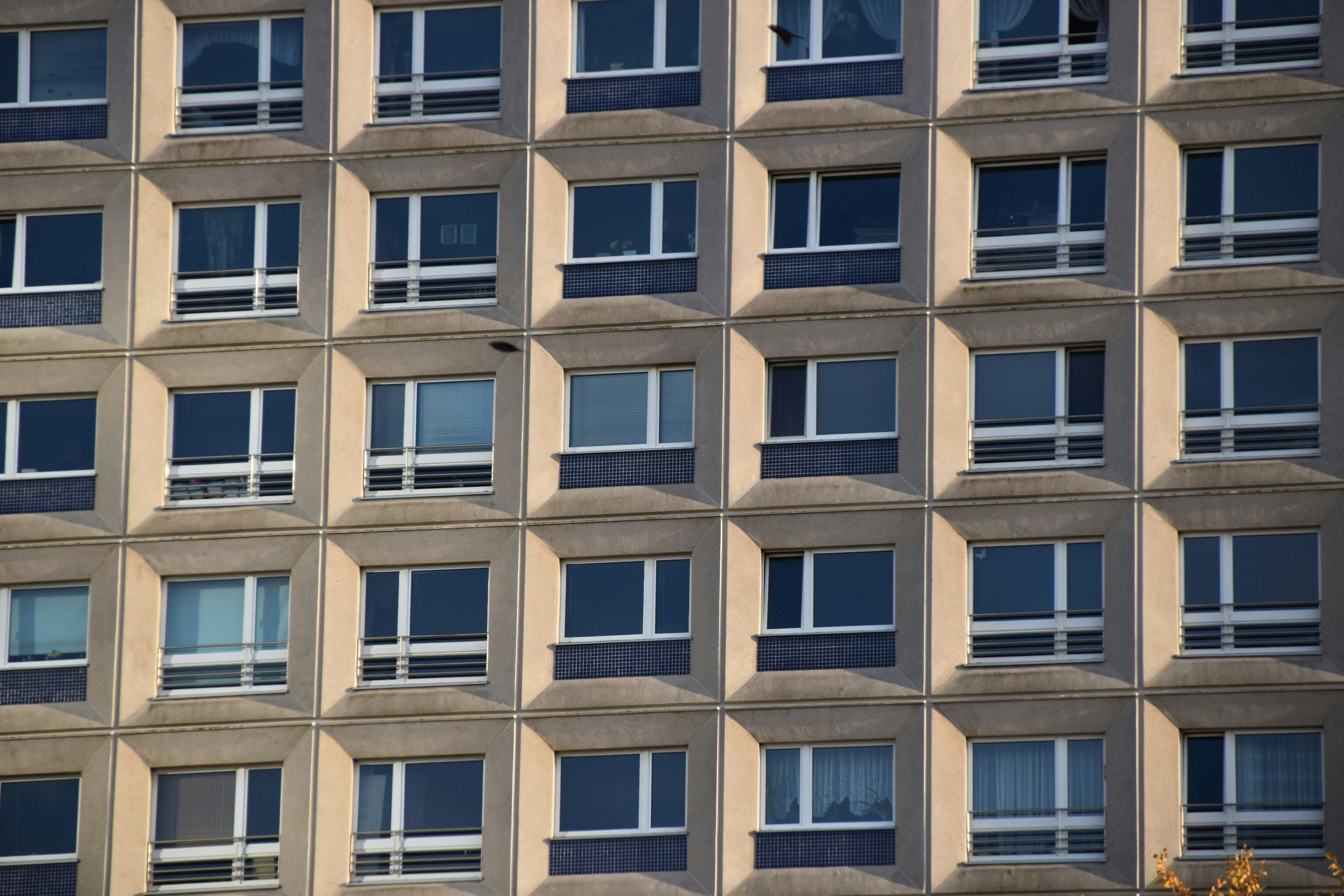 brown and blue concrete building at daytime close-up photography