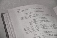 a close up of an open book with writing on it